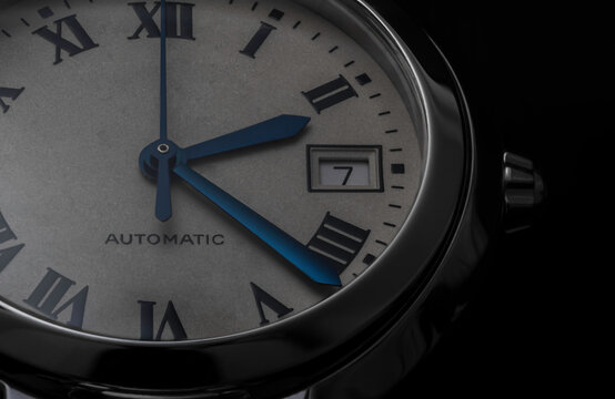 A Detailed Macro Photo Of A Swiss Watch On Black Background. Watch Dial, Hands, Date, Crown, Case Inox Stainless Steal, Sapphire Glass Automatic Movement