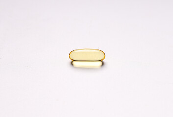 fish oil capsules on white background and supplements concept