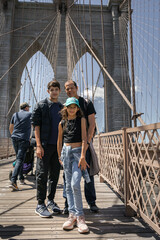 family walking on the bridge