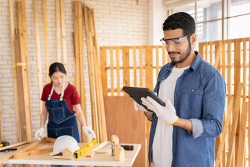 Smart and good looking Asian male carpenter. I am designing furniture to decorate my house. professionally