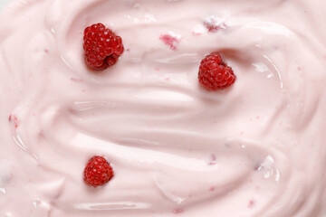 Pink Yogurt with raspberries. Curl of Yogurt. Pink nature yogurt, sour cream, ice cream. Delicious liquid Texture, background. Top view.
