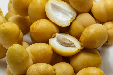 Pile of tasty sweet fresh dates isolated on white background. ,close up