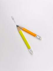 Short yellow orange and green Pencils in a realistic style for various pencil drawing on a white background, clipping path 
