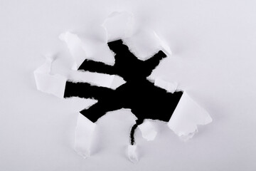 Torn paper inside a black hole in a hole. Banner. Dark torn hole in white paper. Hole paper...