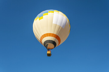 Naklejka premium Hot air balloon flight over Cappadocia, Turkey, Goreme village, hot air balloon parade