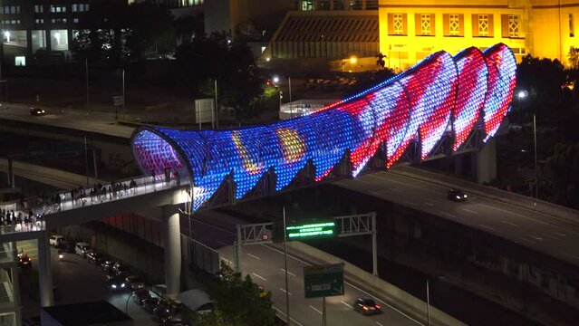 KUALA LUMPUR, MALAYSIA, August 13, 2022 : realtime footage of a pedestrian bridge named Lintasan Saloma near Kuala Lumpur Petronas Twin Tower (KLCC)
