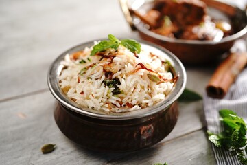 Malabar Ghee Rice or Nei choru with chicken curry, selective focus