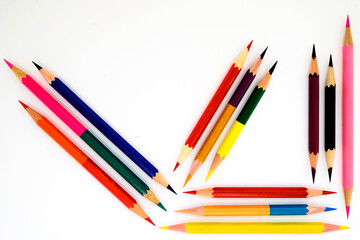 multi-colored pencils for drawing on a white background