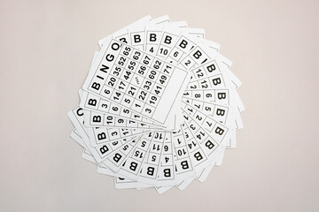 A lot of cards for a board game of bingo or lotto on a light background.