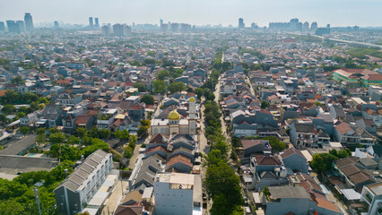 Aerial view of dense housing at misty morning
