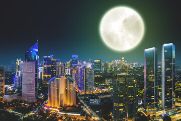 Beautiful glowing city with full moon background