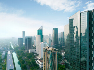 River surrounded by skyscrapers in Jakarta city