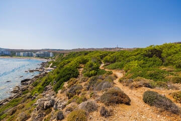 Fototapeta na wymiar Beautiful view from mountain to coastal rocky line of Mediterranean sea with access to territory of sandy beaches hotels on island of Rhodes. Greece.