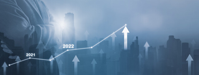 Double exposure-businessman standing cityscape and financial graph,symbol arrow up,stock graph and...