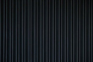 Black Aluminum wall. Wall panels texture. Galvanized steel wall plate. Corrugated metal profiled panel. Vertical lines