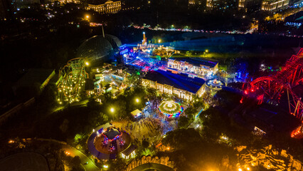 Aerial photography of crowds of lively music festival in China Dinosaur Park and Dino Water Town...