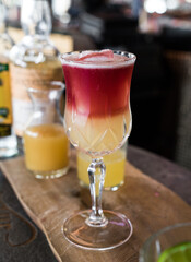 Red & Yellow Summer Cocktail on Bar