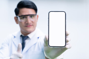 Selective focus at smartphone. Men scientist holding mobile phone mock up with white empty screen...