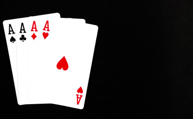 Royal playing cards on a black background.