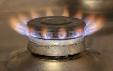 A dilapidated gas burner, burning with the last gas supply. - 524869757