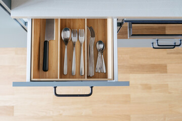 wooden cutlery drawer in kitchen, top view - obrazy, fototapety, plakaty