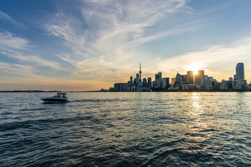 Toronto skyscraper skyline sunset panorama. Lake Ontario, Canada.