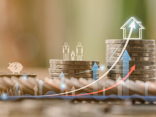 Money saving, finance, investment and loan concept. Close-up stack coins with family who save the money for investment or purchase new house or home. Virtual chart growth up or positive trend.