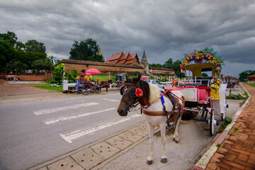 The horse carriage in Lampang at Wat Phra That Lampang Luang , Lampang province in LAMPANG THAILAND.