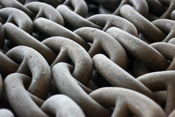 Close up of old metal chains pattern to anchor ships.