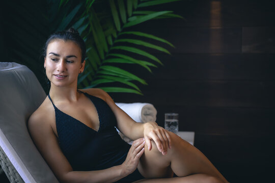 Attractive young woman relaxing in a spa complex.