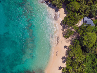 Aerial view from drone of Top Soleil beach at Mahé Island taken in the afternoon light