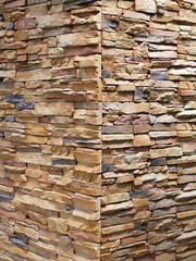 Artificial stone cladding. Designed to resemble real stone. Arranged vertically and attached to the wall with a special adhesive. Used as decoration on the walls of buildings.