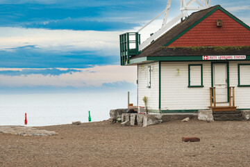 Red and green channel marker bouys off a wooden lifeguard station on Kew Beach in Toronto's Beaches neighbourhood.