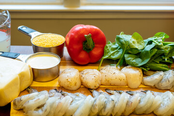 Mise en Place on a Wooden Cutting Board - Shrimp, Scallops, Tomatoes, Spinach, Red Bell Pepper, Fontina Cheese, and Grits 