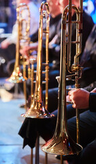 The musical instrument is a trumpet in the hands of a musician. Symphony Orchestra. The concept of...