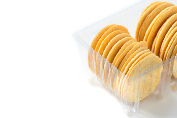 Round Crackers biscuits in plastic box isolated on white background,