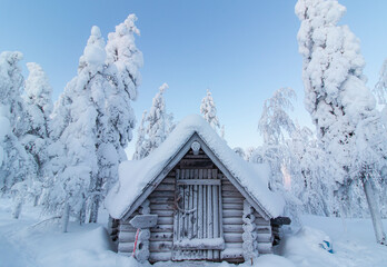Hut in the snowy forest