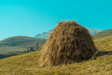Haystack in the mountains on a clear day.