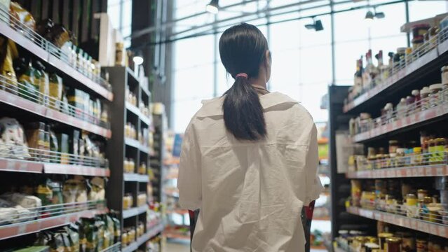 Businesswoman does shopping in supermarket spending weekends