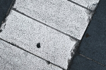 Closeup of road texture and pattern, textured street ground surface, white and dark lines of...