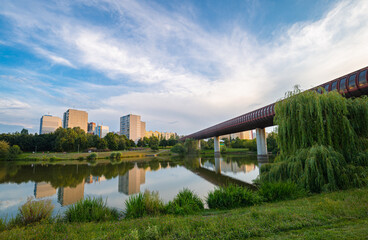 Scenic view of a city park in a suburban area of the city of Prague with Hůrka–Lužiny metro...