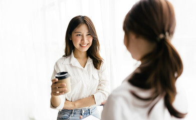 Group of asian young creative happy people entrepreneur on a business meeting office background Good leadership and teamwork lead to success working with financial report.