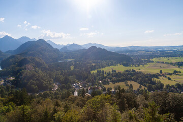 A small village with fields under a blue sky in Munich, Germany