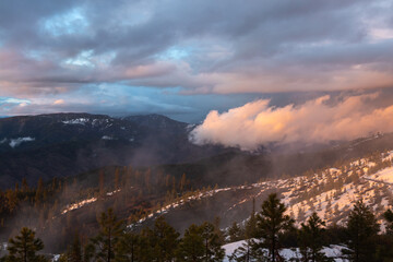 sunset over the hillside near Idaho city outside of a yurt during the snowy winter season