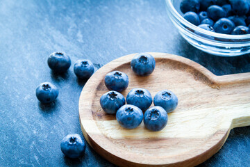 Blueberries on a wooden table. Fresh berries. Wild blueberries on a wooden stand