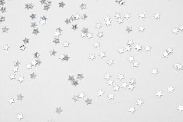 sparkles silver stars on white background with text place- Image