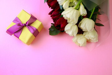 tulips  and gift box on pink background. Stylish soft image of spring flowers. Happy womens day. Happy Mothers day- Image