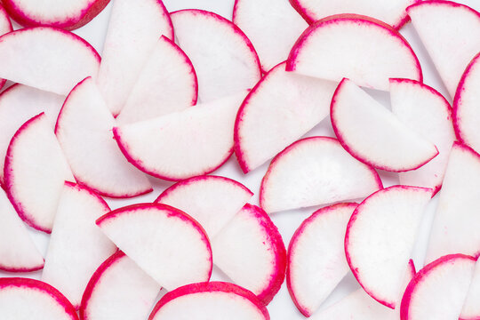 vegetables roots of radish sliced into half rings like background
