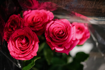 Red roses in a flower shop.Flowers in a flower shop. Concept flower store and delivery.