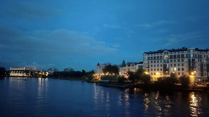 Urban landscapes. Night view of the embankment, the river and the buildings of St. Petersburg. Russia.